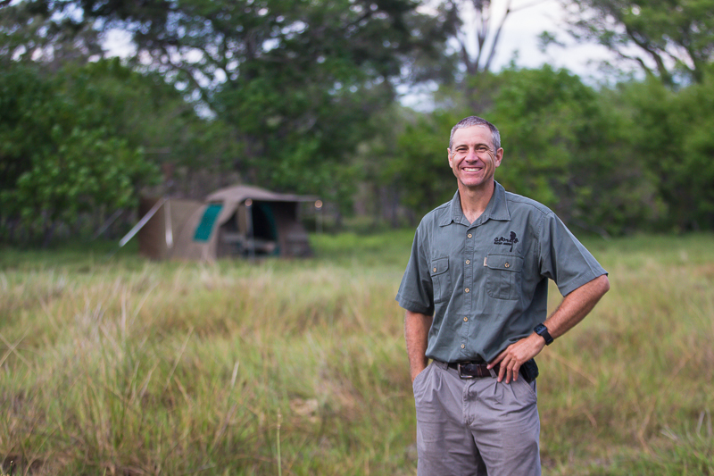 Guide smiling in forest